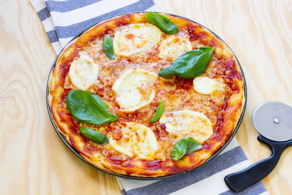 Piza with mozzarella and tomato sauce