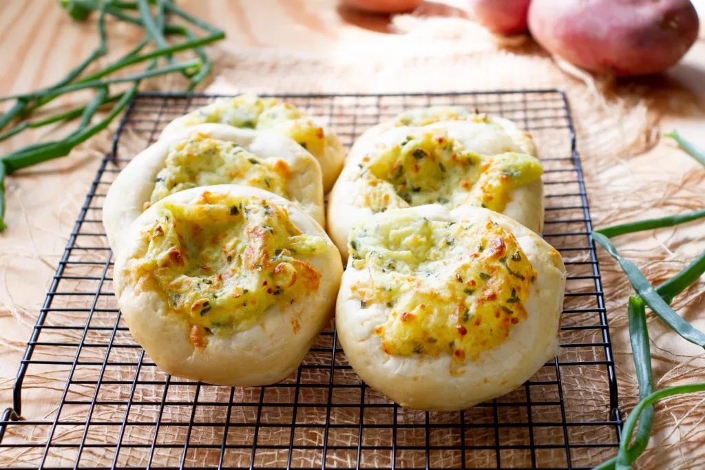Yeast buns with cheese and potato filling
