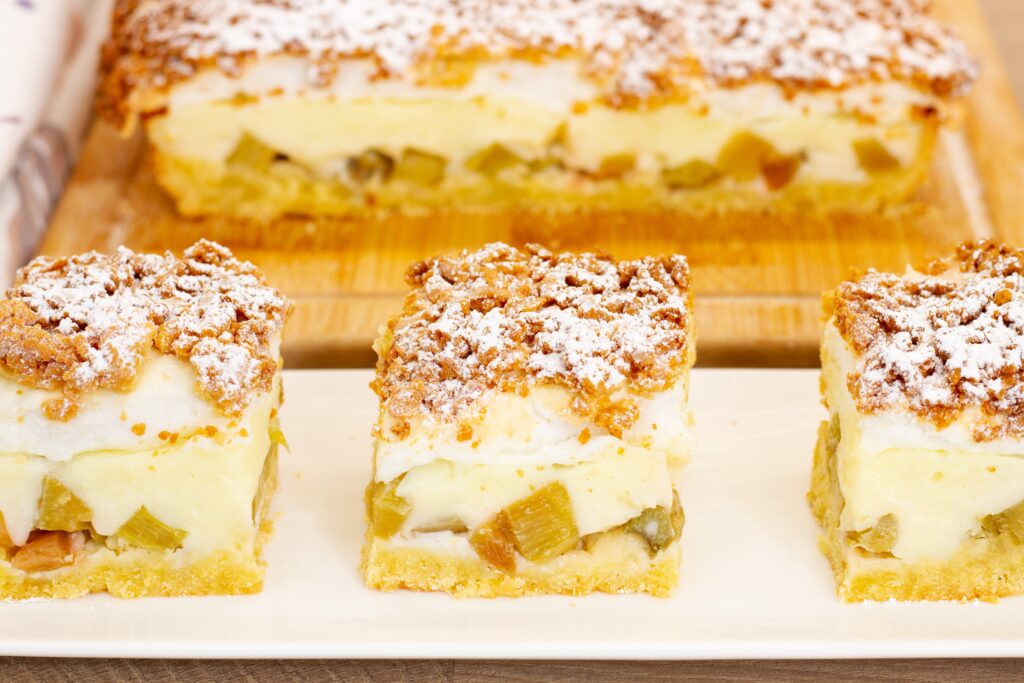 Homemade shortcrust pastry topped with tangy rhubarb, creamy custard and golden meringue