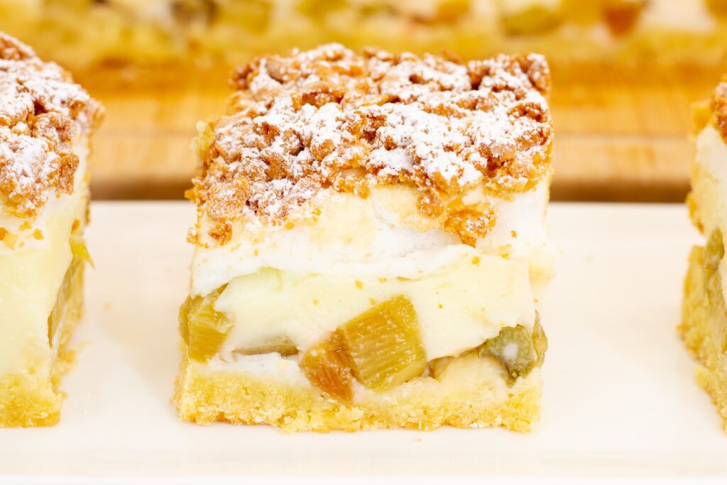 Homemade shortcrust pastry topped with tangy rhubarb, creamy custard and golden meringue