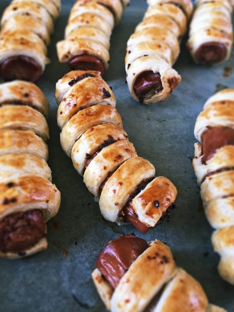Baked frankfurter sausages in puff pastry