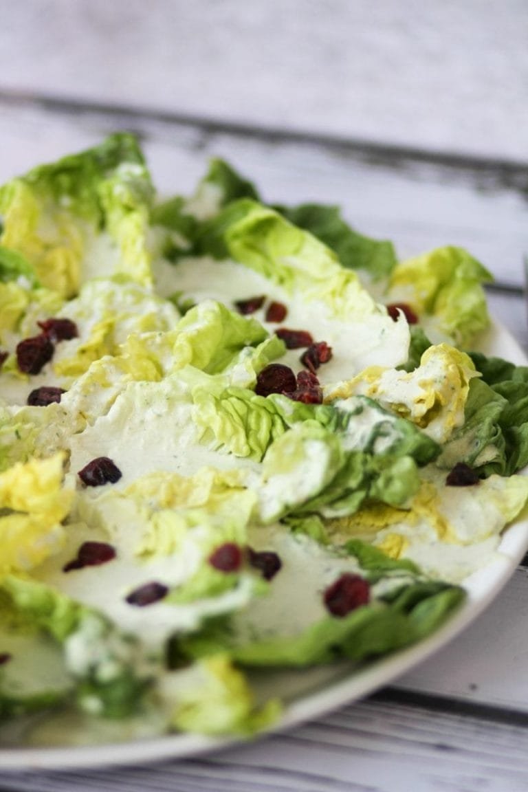 Salad with blue cheese sauce and cranberries