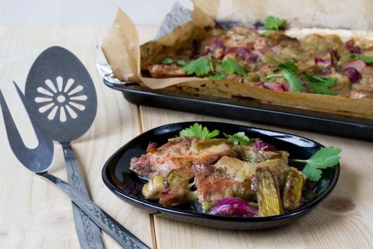 Baked pork leg with rhubarb and onion