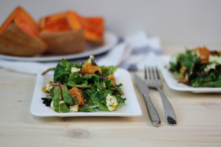Pumpkin and goat cheese salad with pumpkin seeds with pumpkin seeds