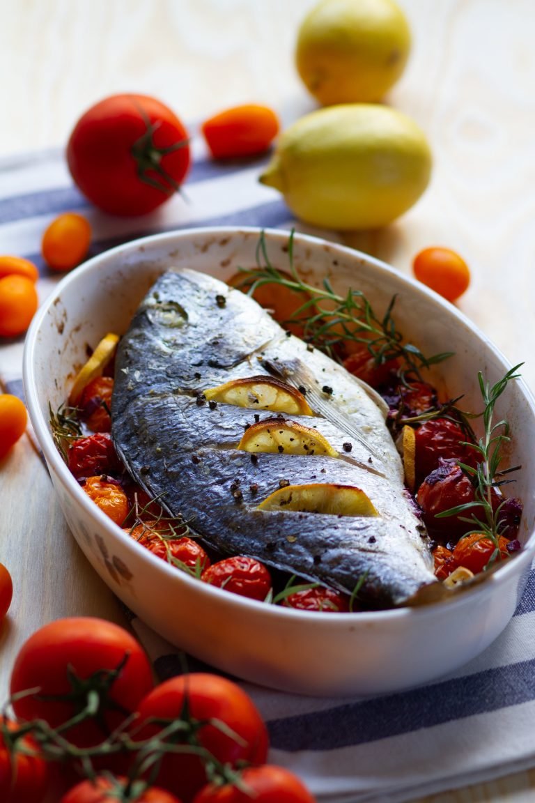 Fish baked with tomatoes and rosemary