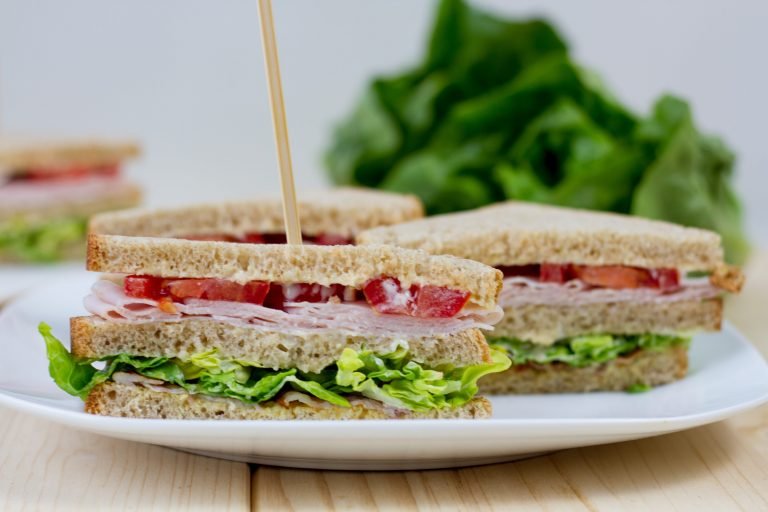 Club sandwich with meat and salad