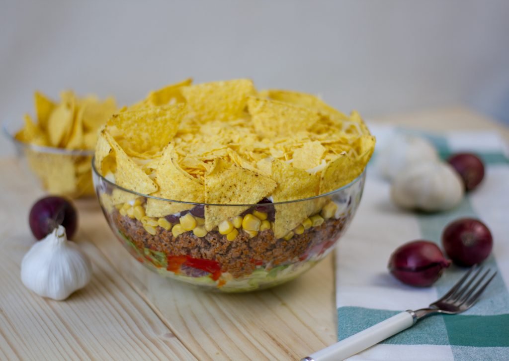 Salad with nachos and minced meat