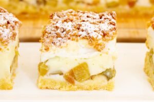 Homemade shortcrust pastry topped with tangy rhubarb, creamy custard and golden meringue