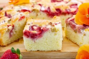 Homemade rhubarb and strawberry cake – fluffy, fruity, and full of seasonal flavour.